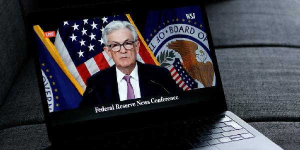Bitcoin Rises as Fed Holds Rates Steady